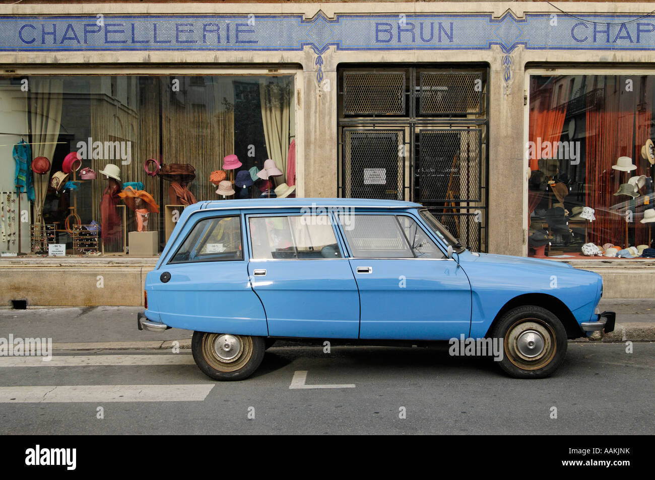Old blue Citroen parked outside traditional hat shop Tours France Europe Stock Photo