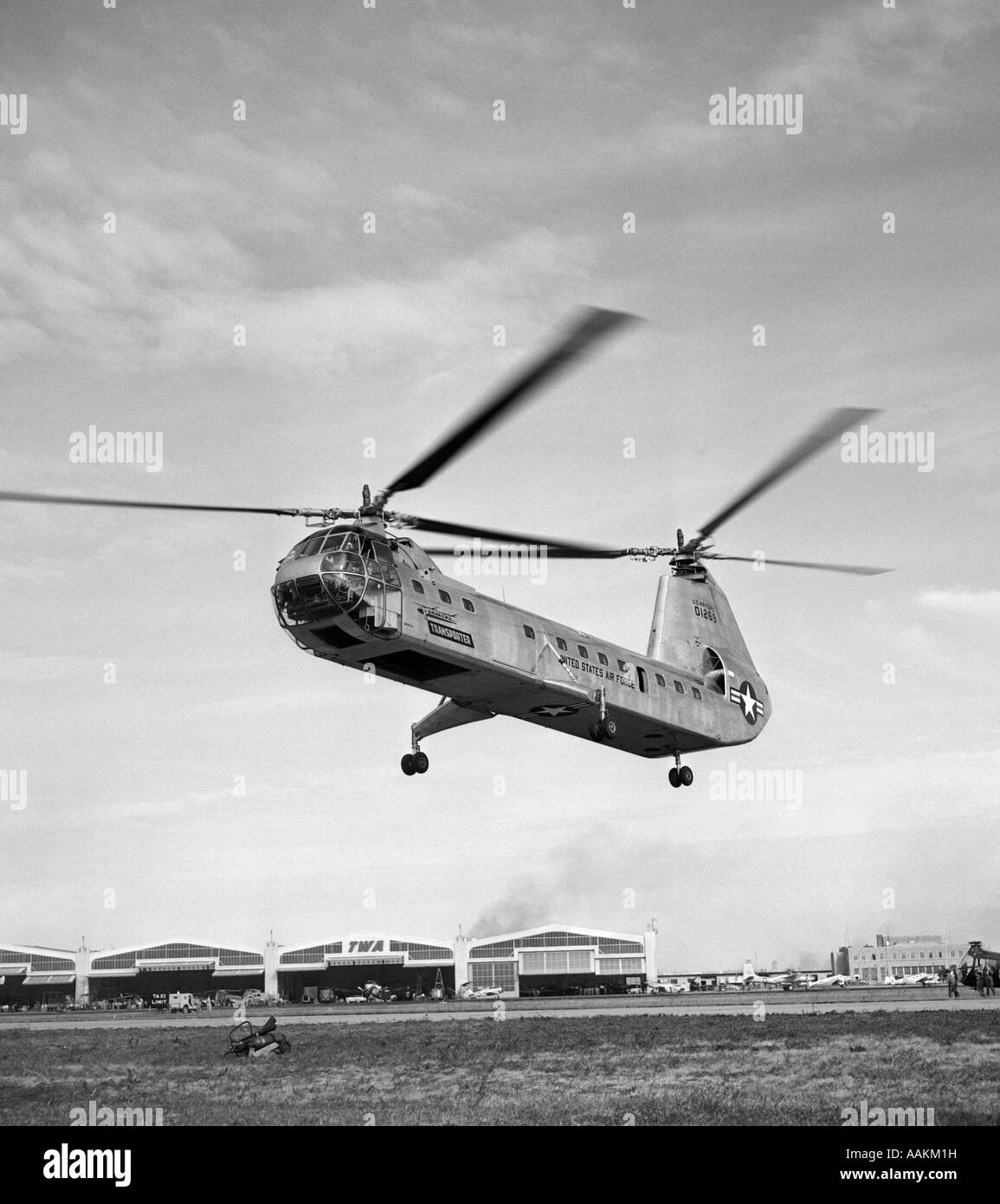 1950s AIR FORCE HELICOPTER TAKING OFF FROM BASE Stock Photo