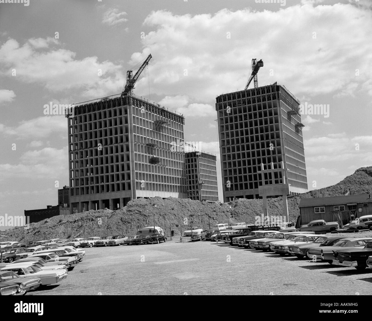 1960s CONSTRUCTION SITE OF 3 NEW IDENTICAL APARTMENT BUILDINGS Stock