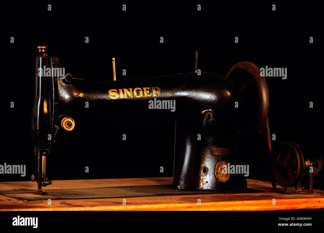 Antique Singer Sewing Machine On Wooden Cabinet Stock Photo