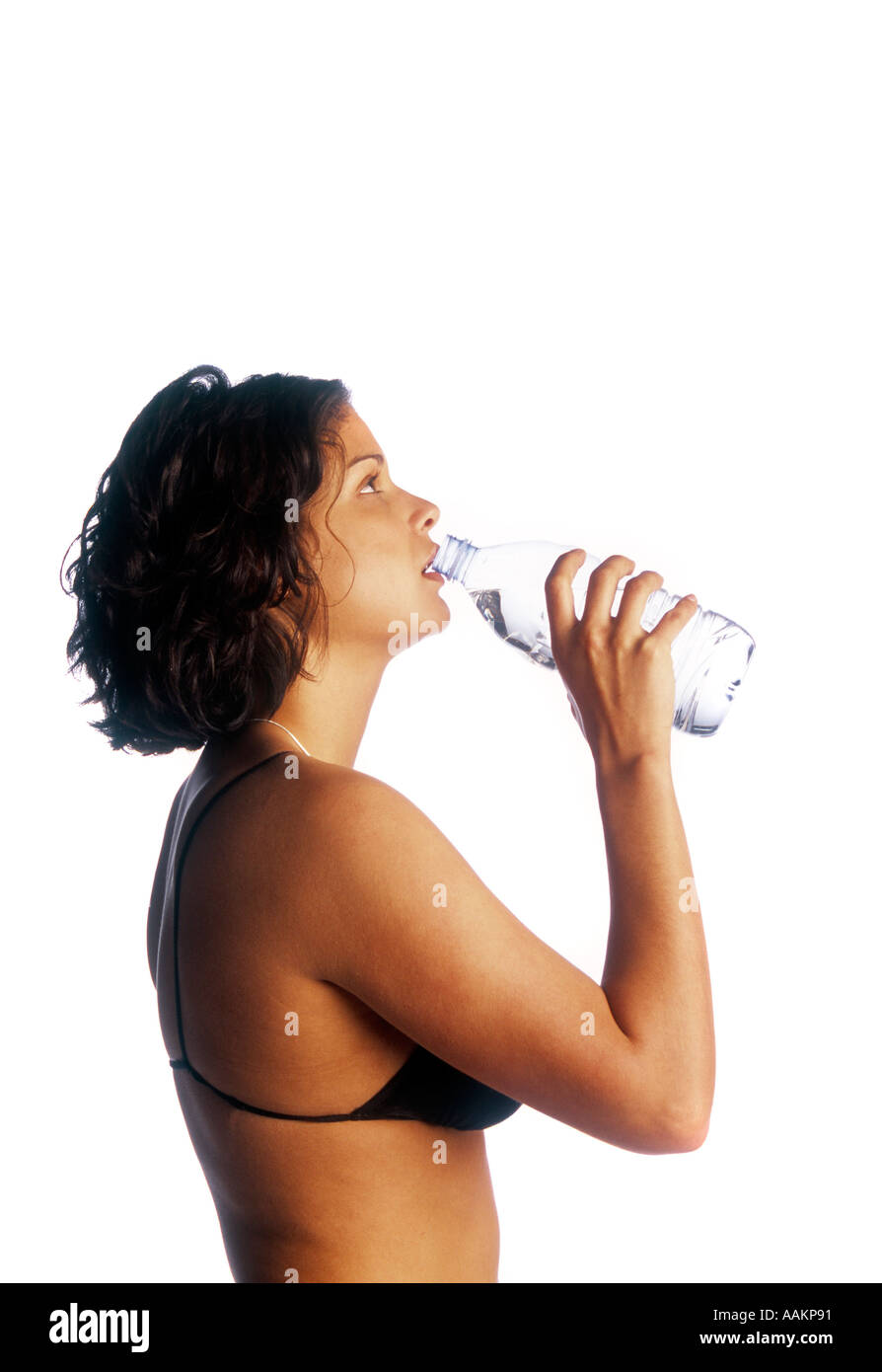 image of woman in bikini top holiding a water bottle Stock Photo