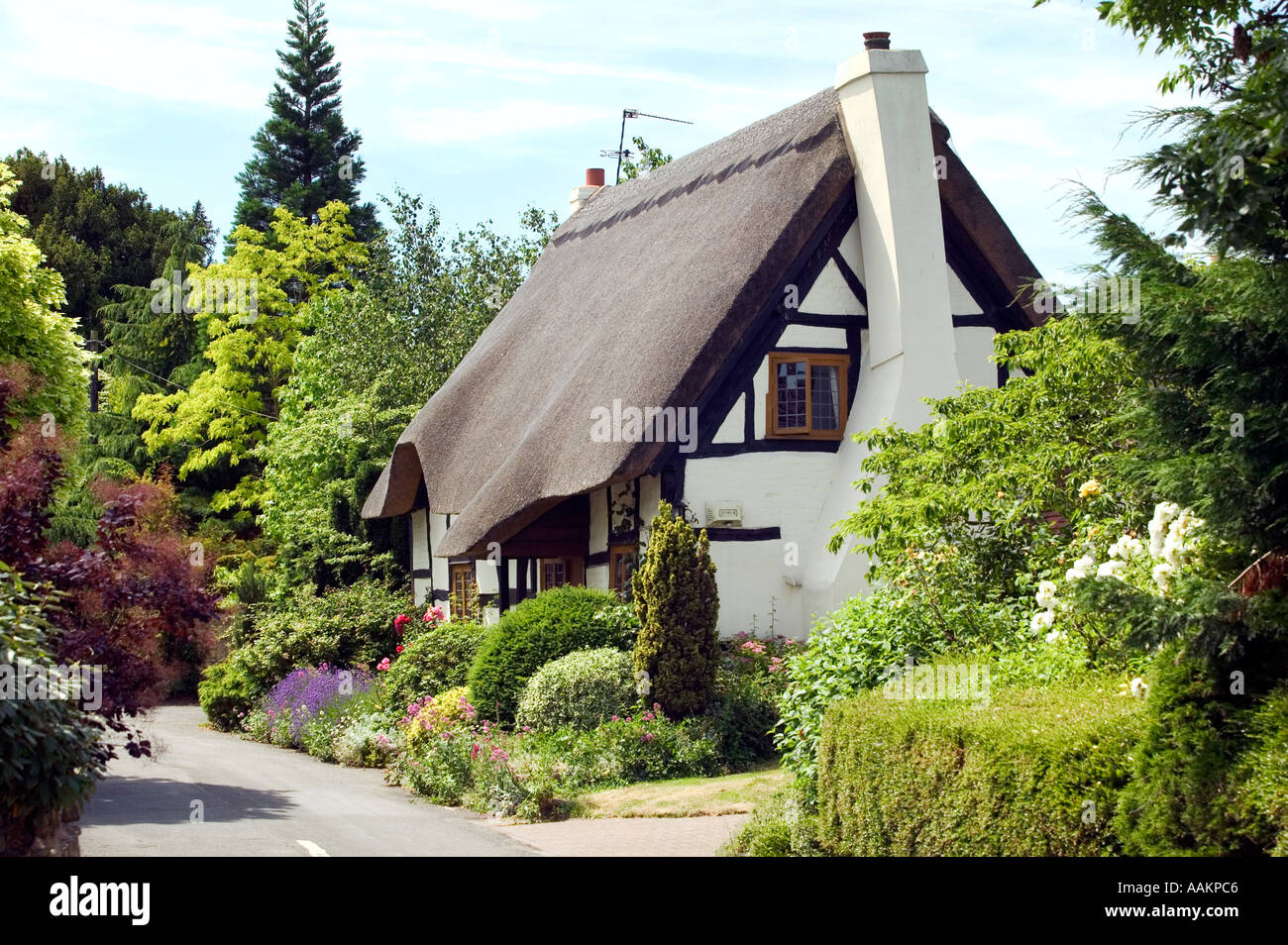 A thatched cottage in the village of Little Comberton in Worcestershire UK Stock Photo