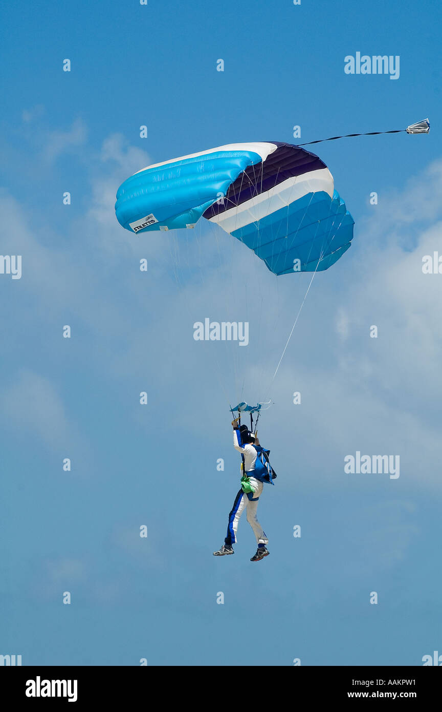 Skydiver jumper landing a 'square' ramair parachute Stock Photo Alamy