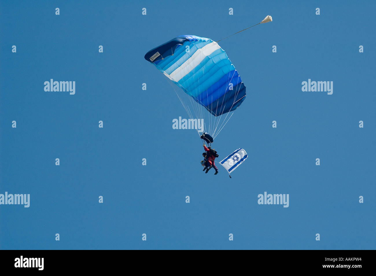 Two Israeli skydivers in tandem jump landing a 'square' ram-air parachute Stock Photo