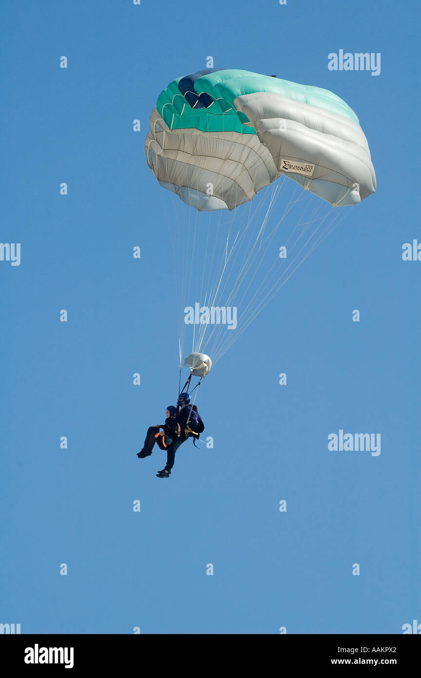 Two skydivers in tandem jump  landing a 'square' ram-air parachute Stock Photo