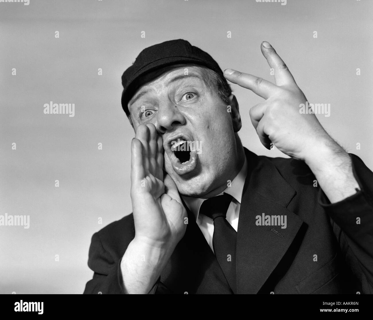 1950s BASEBALL UMPIRE CALLING A BALL OR A STRIKE OR AN OUT LOOKING AT CAMERA Stock Photo