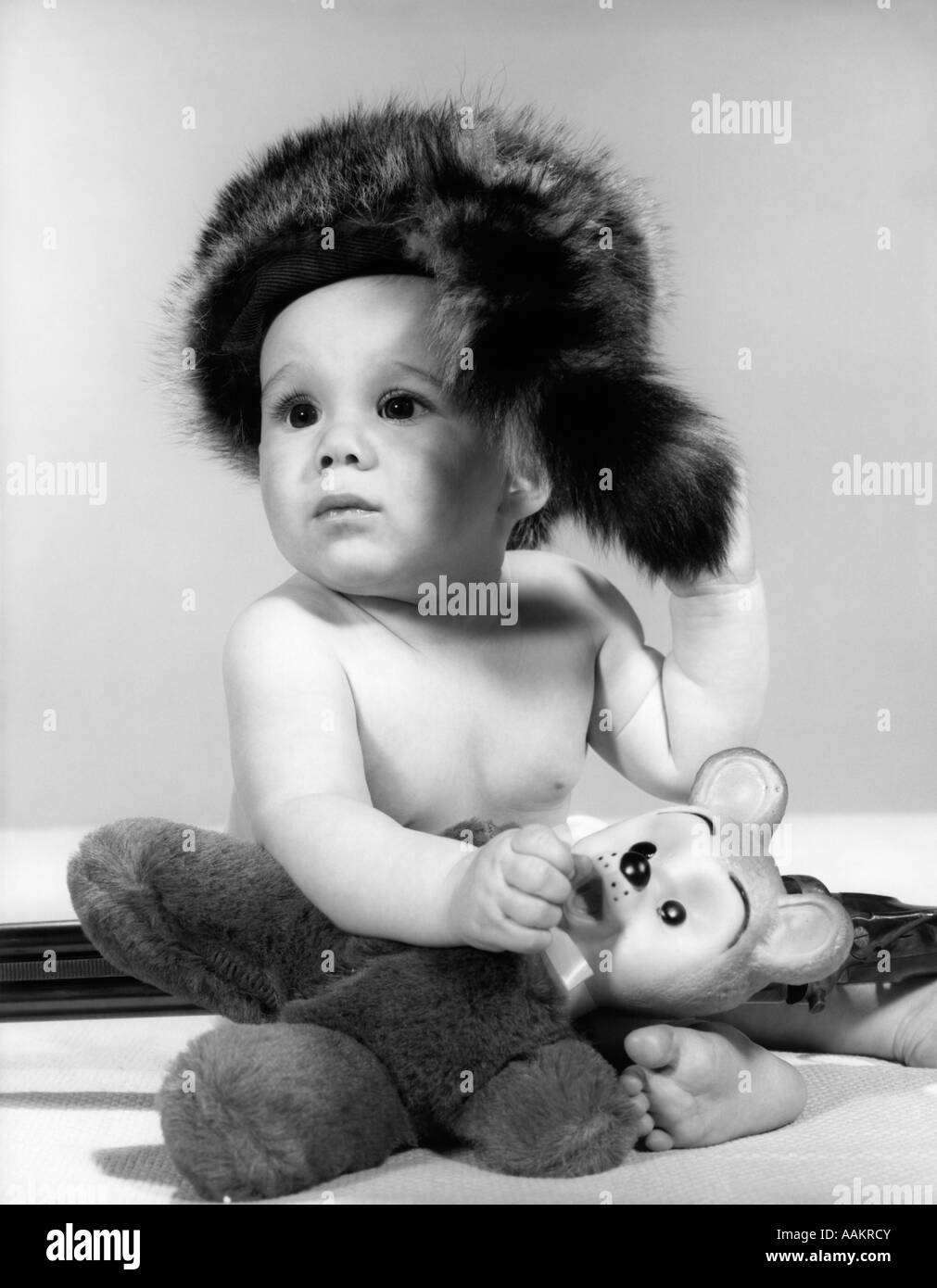 1960s BABY WEARING COONSKIN HAT Stock Photo Alamy