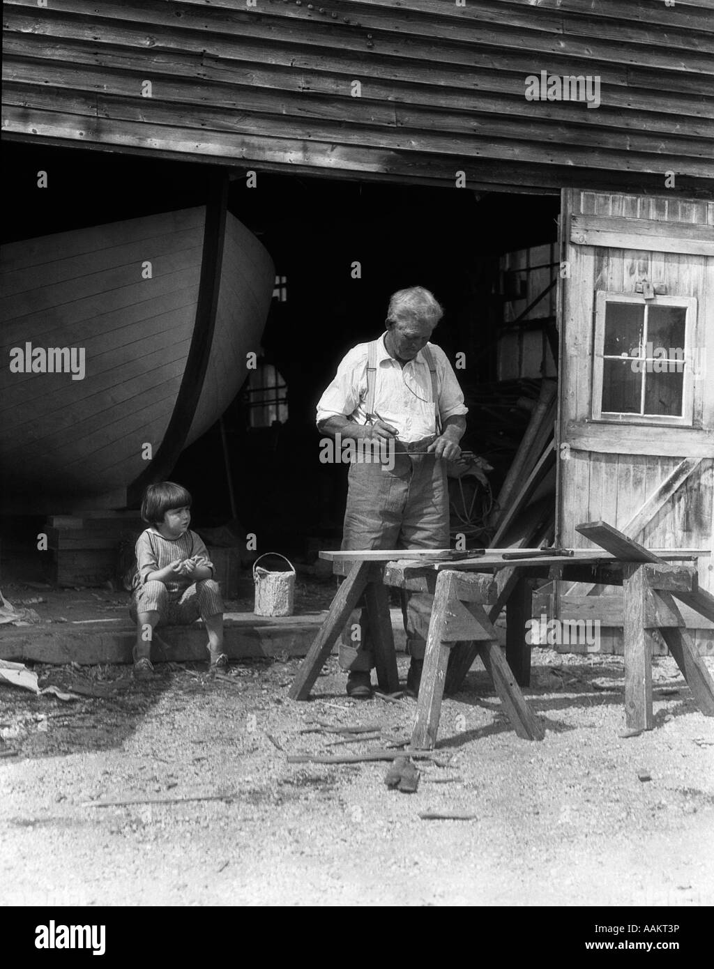 1920s 1930s ELDERLY MAN GREAT GRANDFATHER WORKING AT SAW HORSES AS