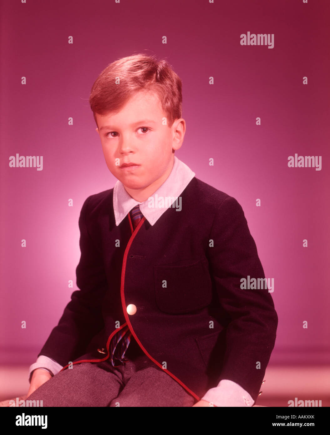 1960s STUDIO PORTRAIT LITTLE BOY SERIOUS EXPRESSION Stock Photo