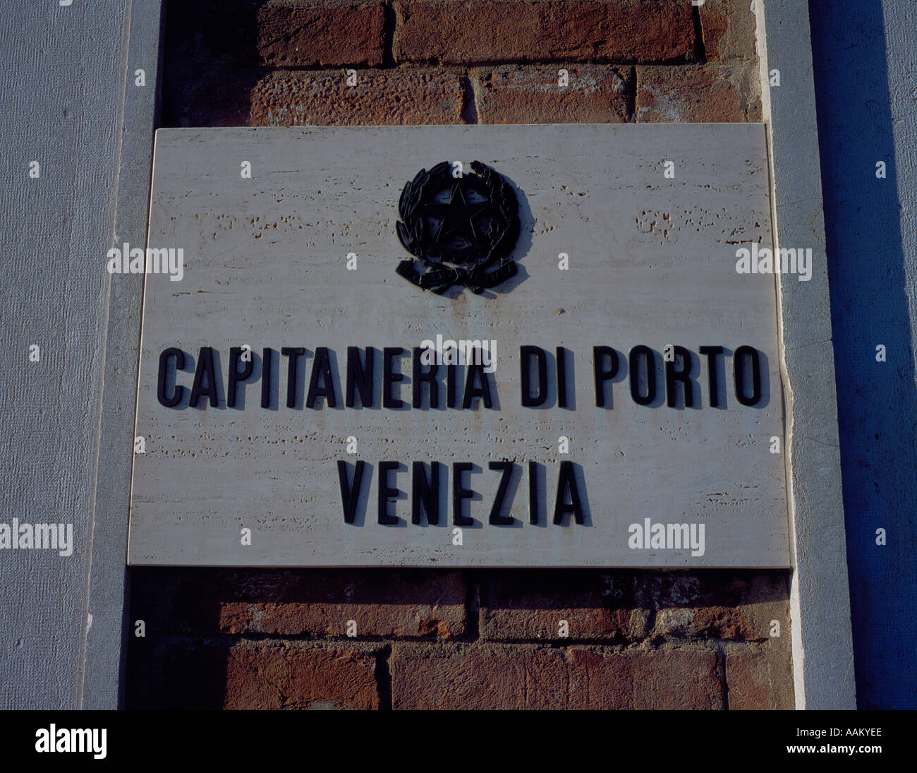 Capitaneria skipper captain office sign building wall port harbour harbor Venice Italy Europe. Photo by Willy Matheisl Stock Photo