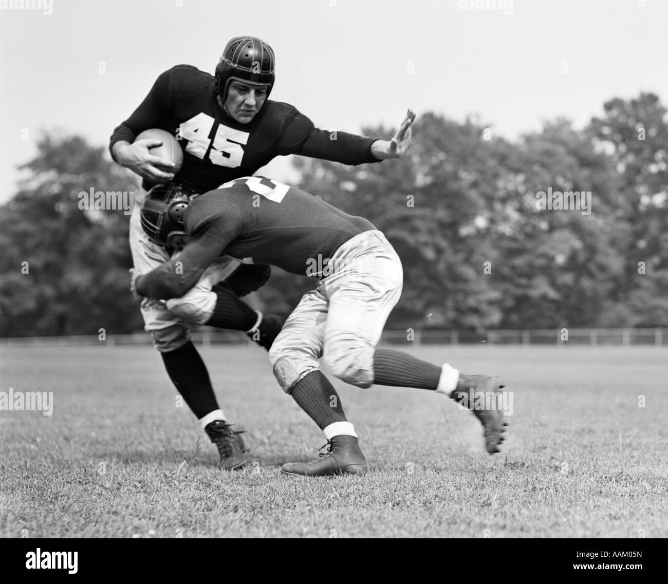 1940s FOOTBALL PLAYER BEING TACKLED Stock Photo