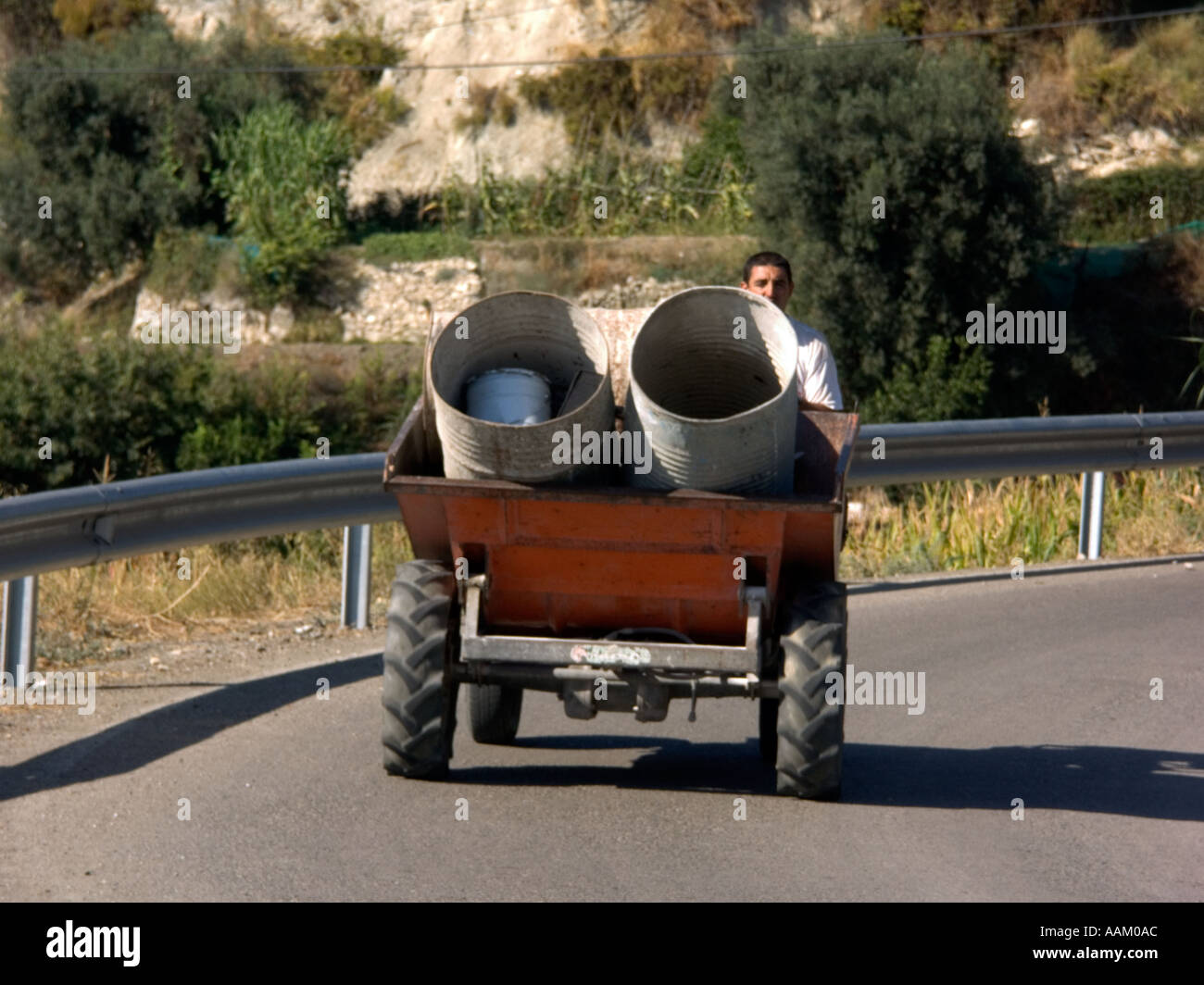 Dumper Truck with Old Oil Drums Sedella Andalucia Spain dump dumper