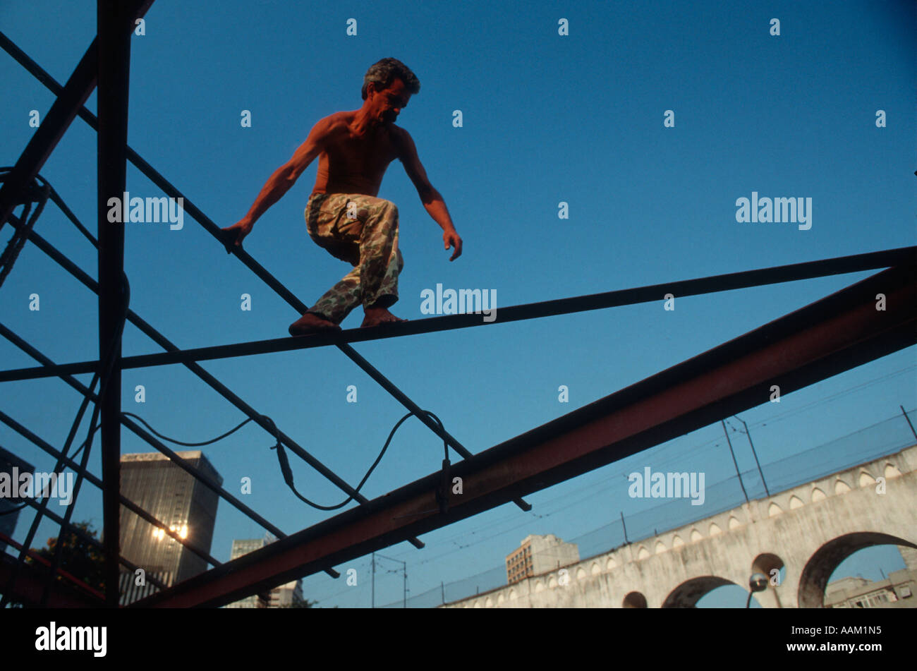 Construction worker using no safety gears. Risky conditions of work, unhealthy job, Brazil. Stock Photo