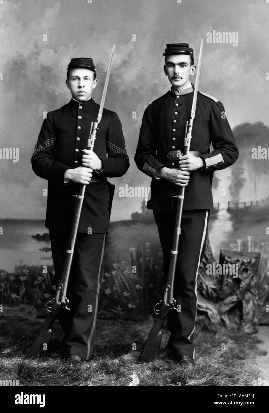 PORTRAIT OF TWO UNION SOLDIERS STANDING HOLDING BAYONETS Stock Photo