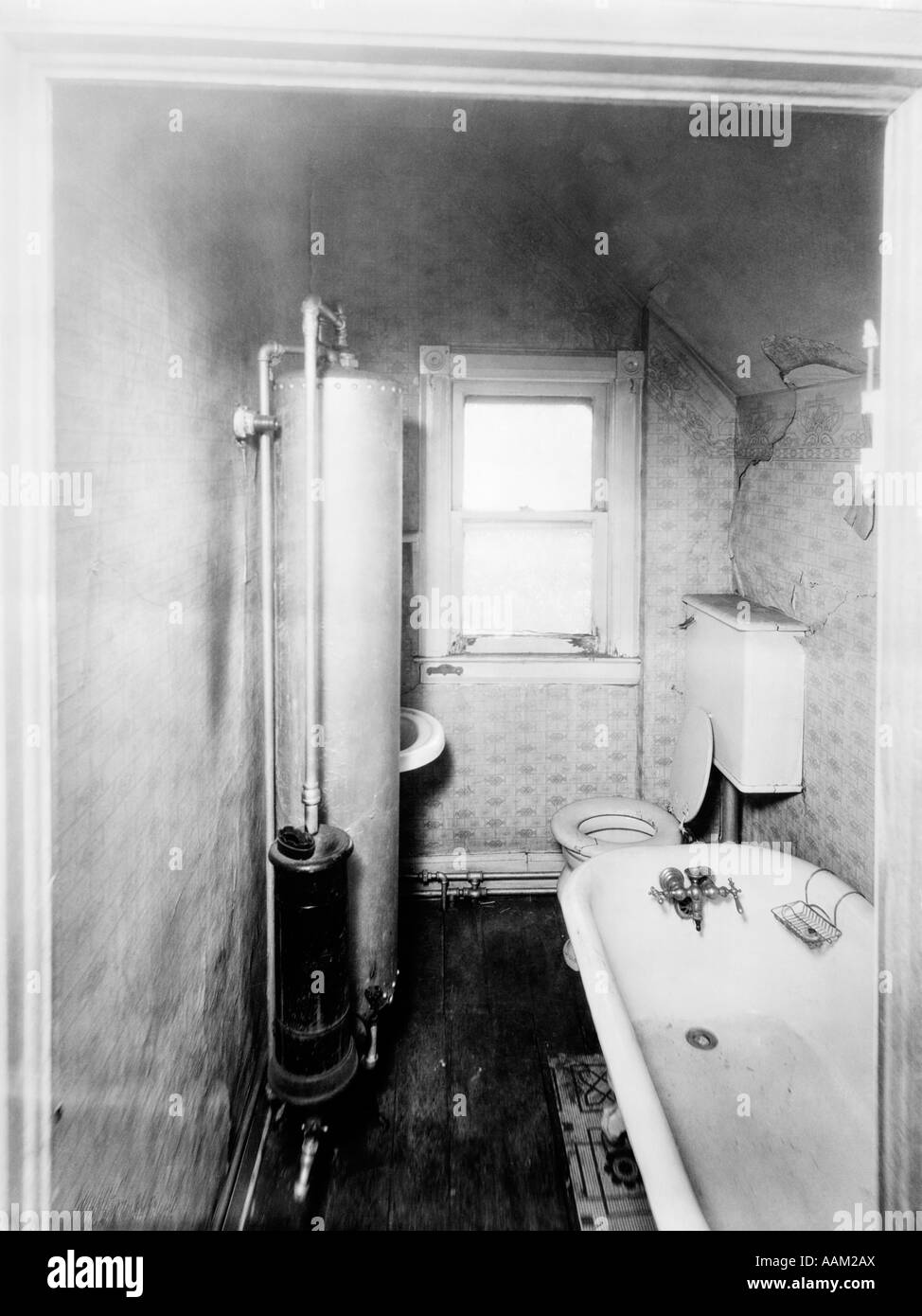 1900s GAS WATER HEATER BATHROOM Stock Photo