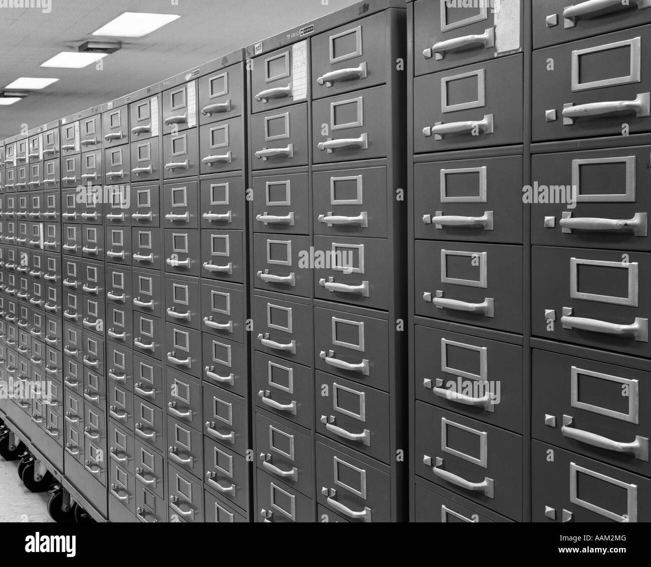 1970s ANGLED VIEW OF SERIES OF INDEX CARD FILE ON WHEELS Stock