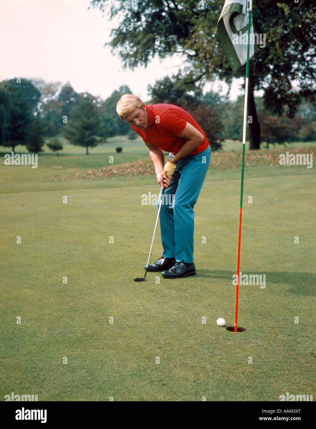 GOLFER PUTTING Stock Photo