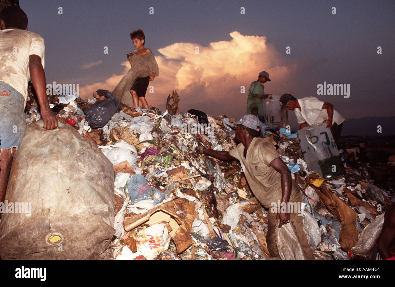 Brazil. Family with children work at garbage deposit ( dump Stock Photo