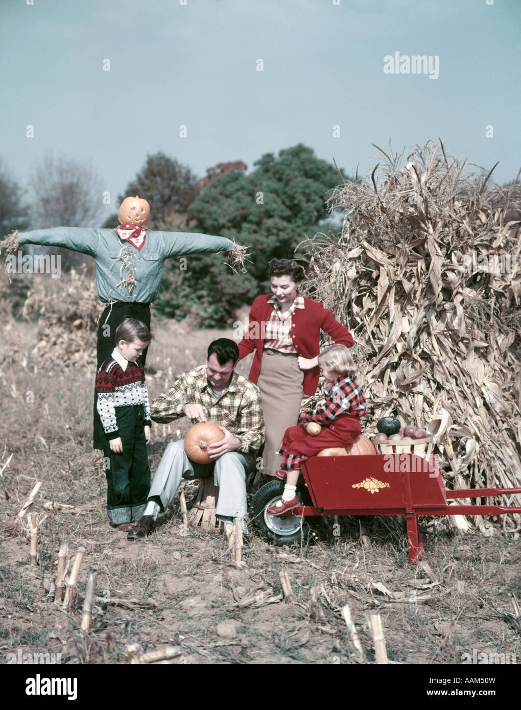 1950s FAMILY MAN FATHER WOMAN MOTHER BOY SON GIRL DAUGHTER IN AUTUMN ...