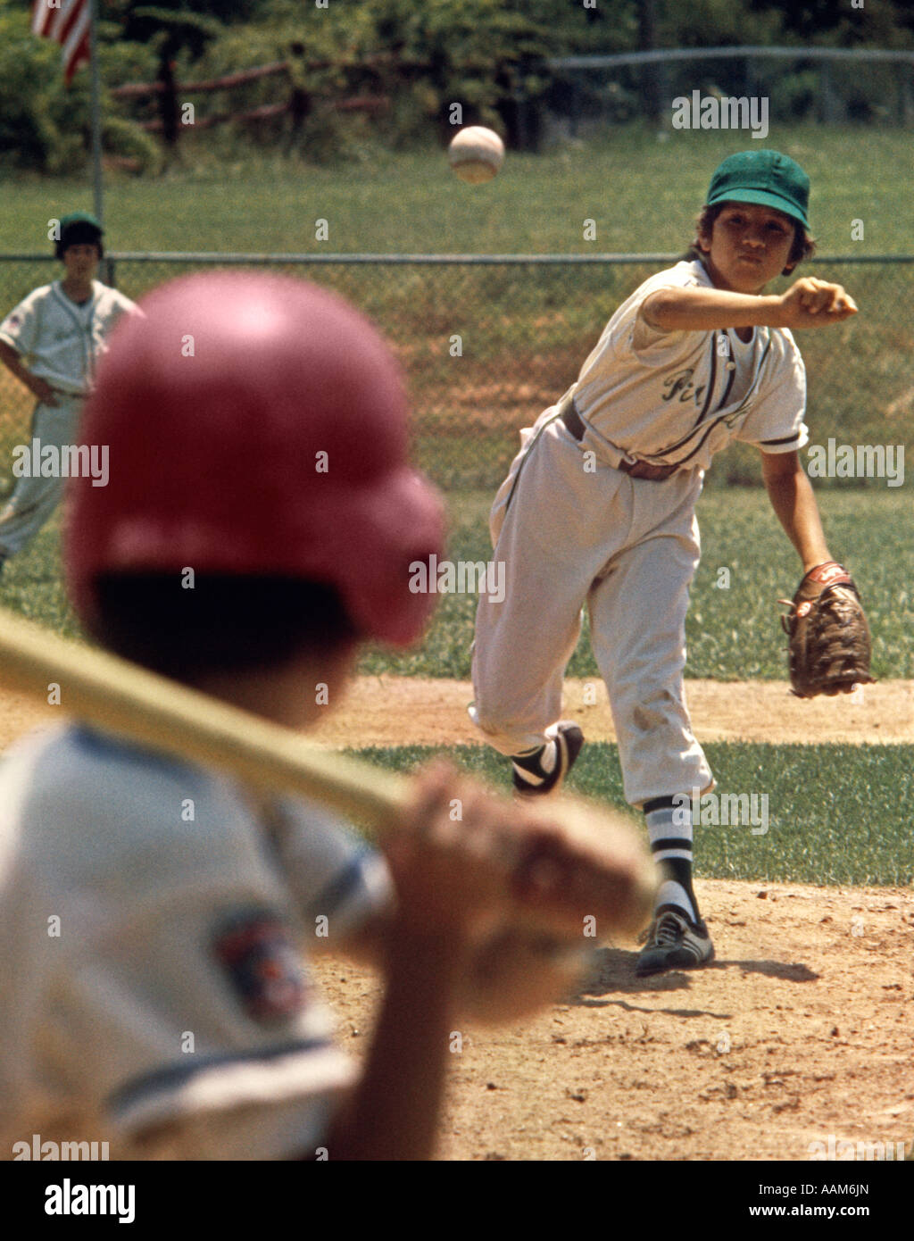 1970s LITTLE LEAGUE BASEBALL GAME BOY PITCHER THROWING BALL TO BATTER