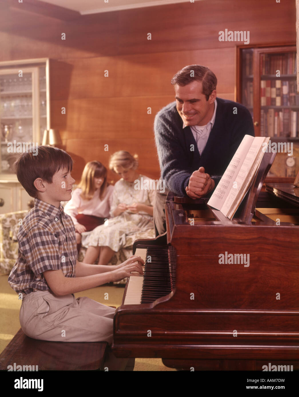 1970 1970s Family Living Room Boy Son Playing Piano Father