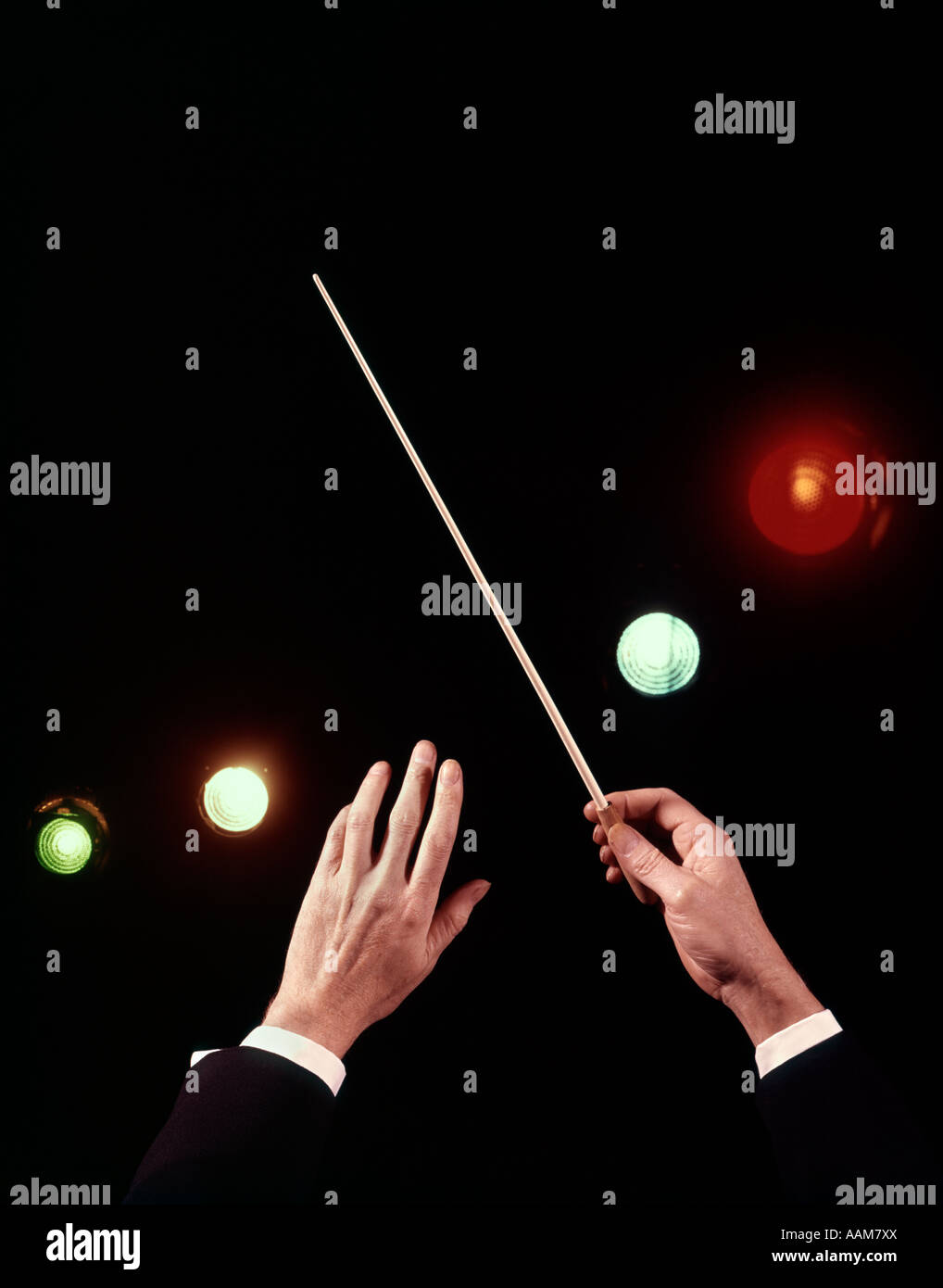 1970s HANDS BATON COLORED LIGHTS ORCHESTRA CONDUCTOR Stock Photo