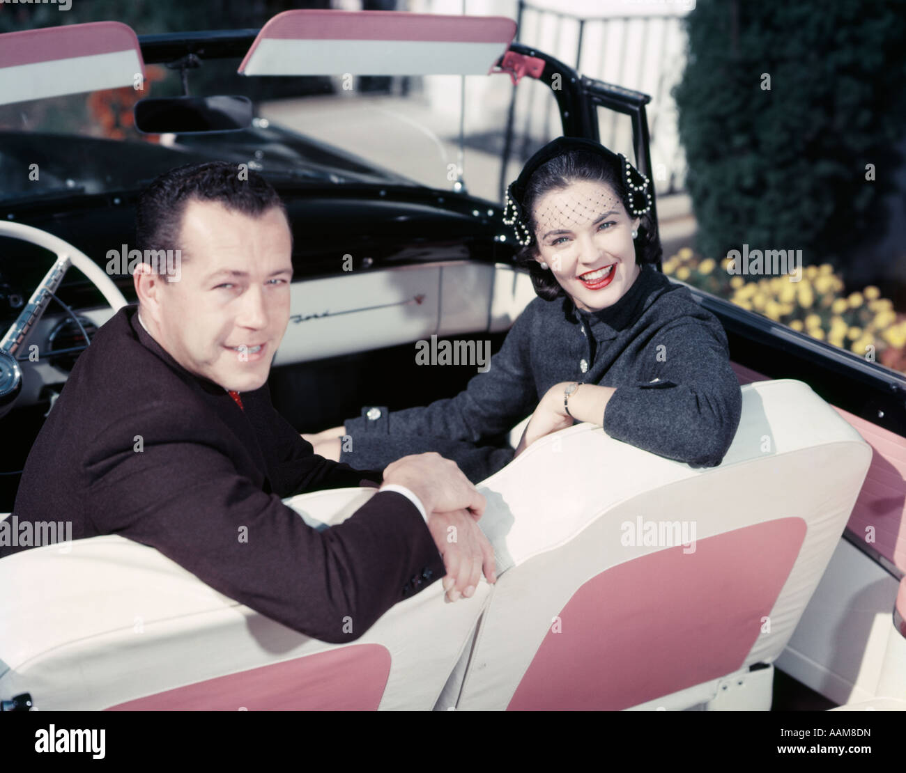 1950s SMILING COUPLE MAN WOMAN IN FRONT SEAT TURNED LOOK BACK 1950s-smiling-couple-man-woman-in-front-seat-turned-look-back
