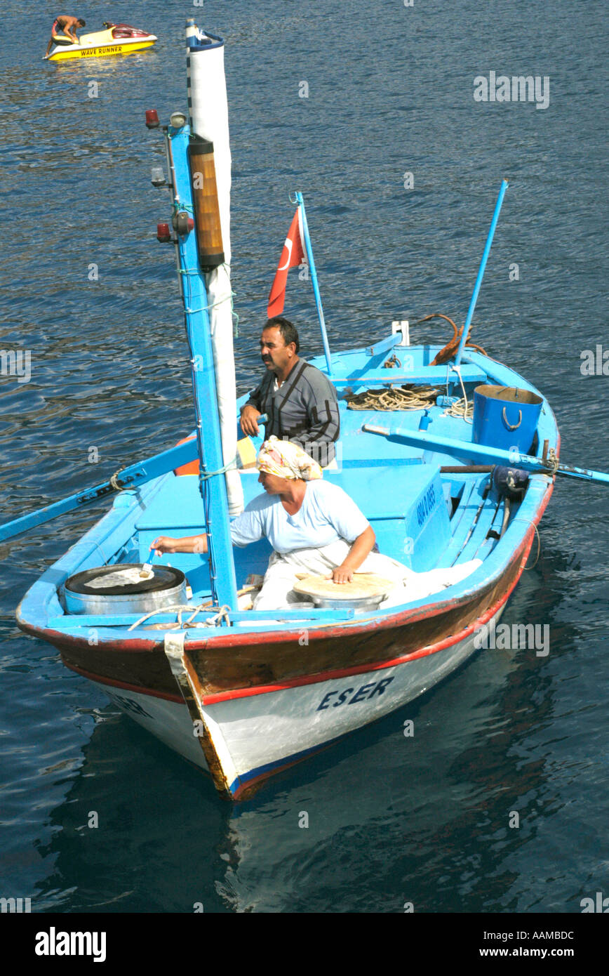 Turkey, Southwest, Gulf of Fethiye at St Nicholas Island, The pancake lady ,Floating pancake service sells to tourists Stock Photo