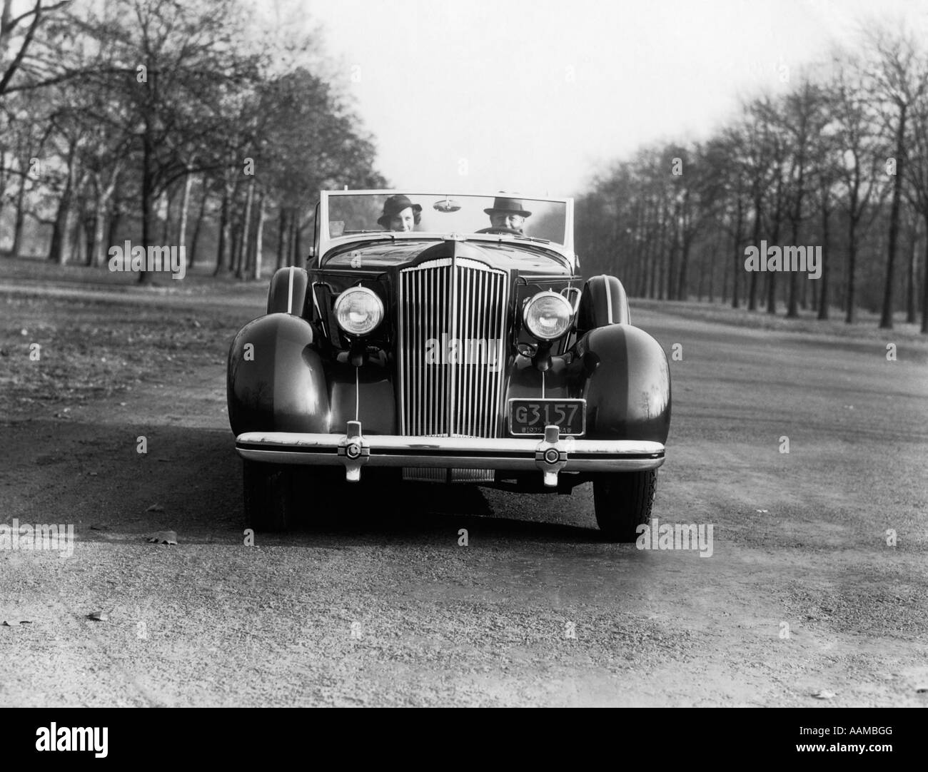 1930s 1935 COUPLE MAN AND WOMAN DRIVING PACKARD CONVERTIBLE Stock ...