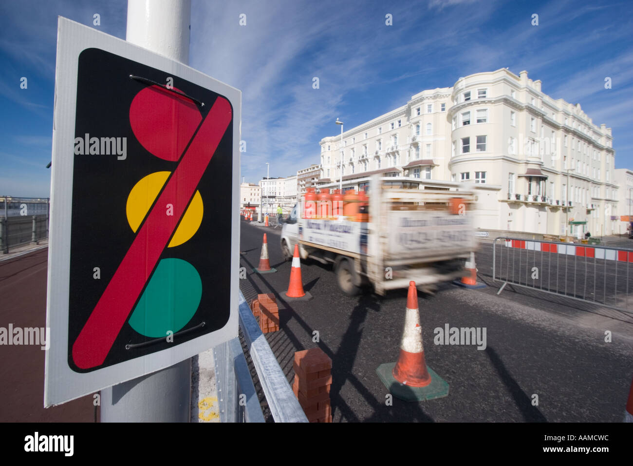 Traffic lights out of order van speeding through roadworks Stock Photo
