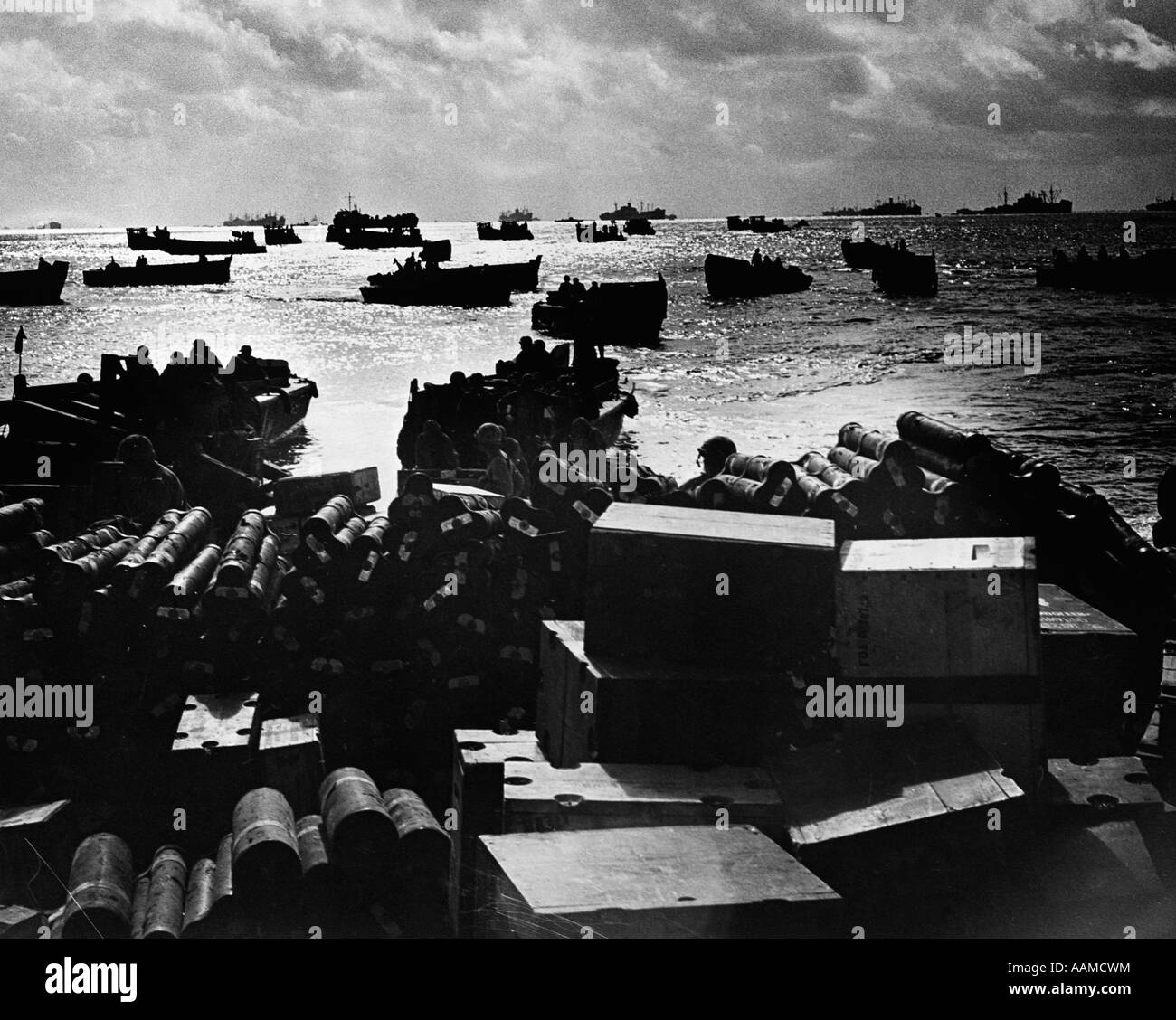 1940s WORLD WAR II DAWN DUSK COAST GUARD LANDING CRAFT CROWDING SHALLOW INVASION WATERS SOLDIERS Stock Photo