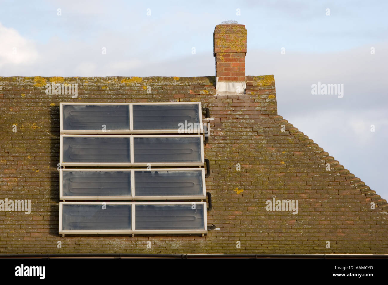 Holiday homes with roof mounted solar panels overlooking the beach in East Sussex UK Stock Photo
