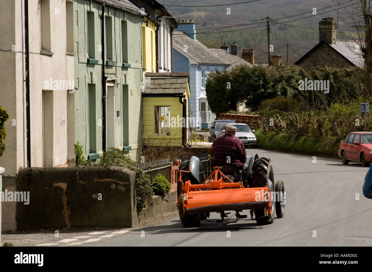 Farmer driving his old Massey Ferguson (fergie) tractor through