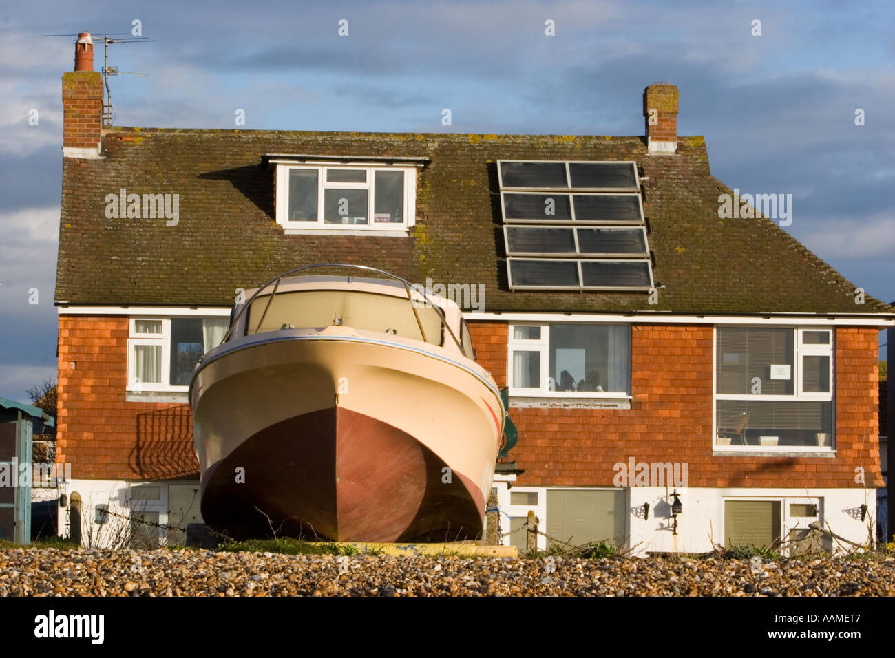 Holiday homes with roof mounted solar panels overlooking the beach in