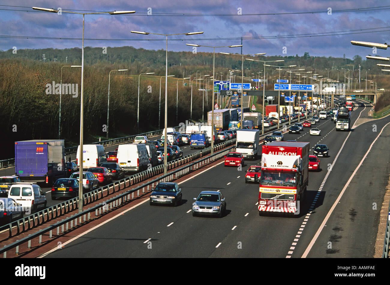 Heavy traffic of trucks and cars on M1 Motorway near Luton Hertfodshire