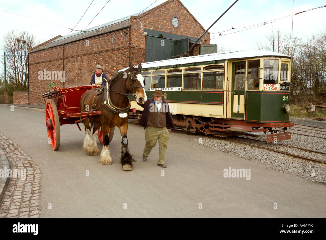 UK England West Midlands Dudley Black Country Museum shirehorse cart passing tram Stock Photo