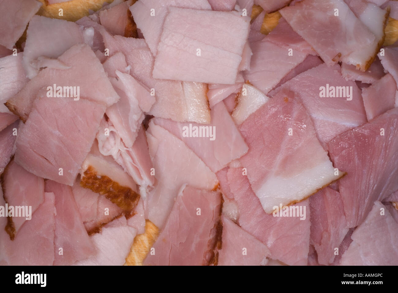 sliced ham ready for pizza topping Stock Photo Alamy