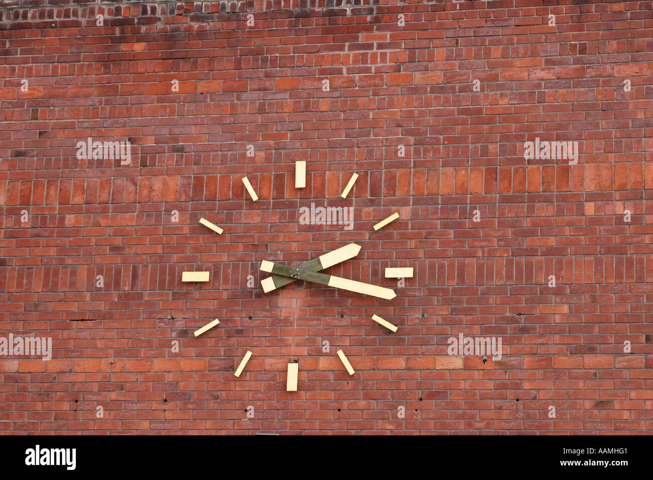 A big clock on a brick wall Stock Photo