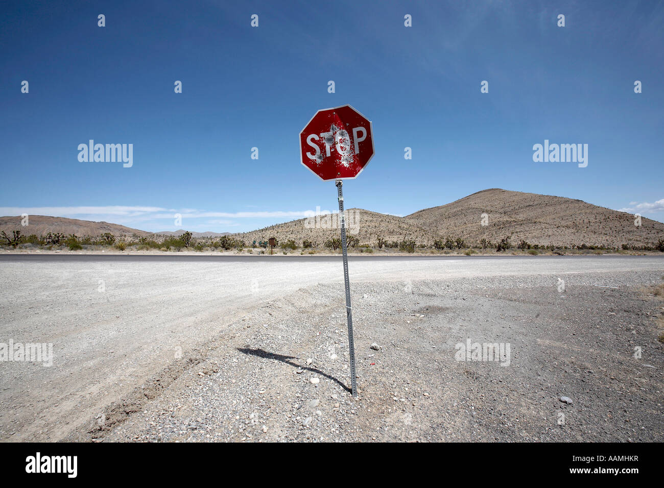 A stop sign with dents from bullets in Nevada United States Stock Photo