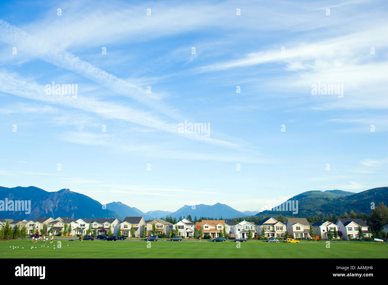 Row of suburban houses near mountain range Stock Photo