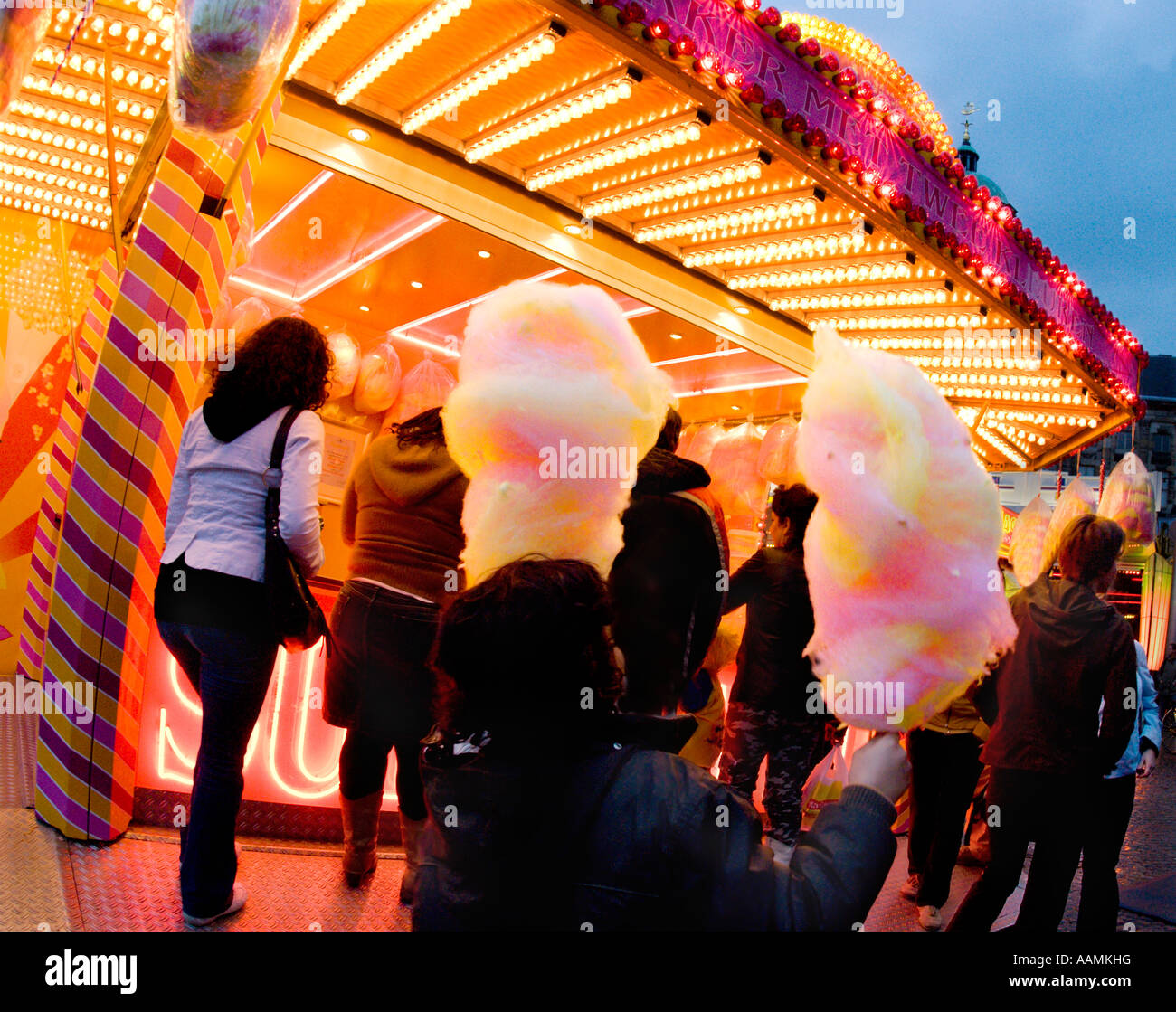 people buying cotton candy at amusement park Stock Photo - Alamy