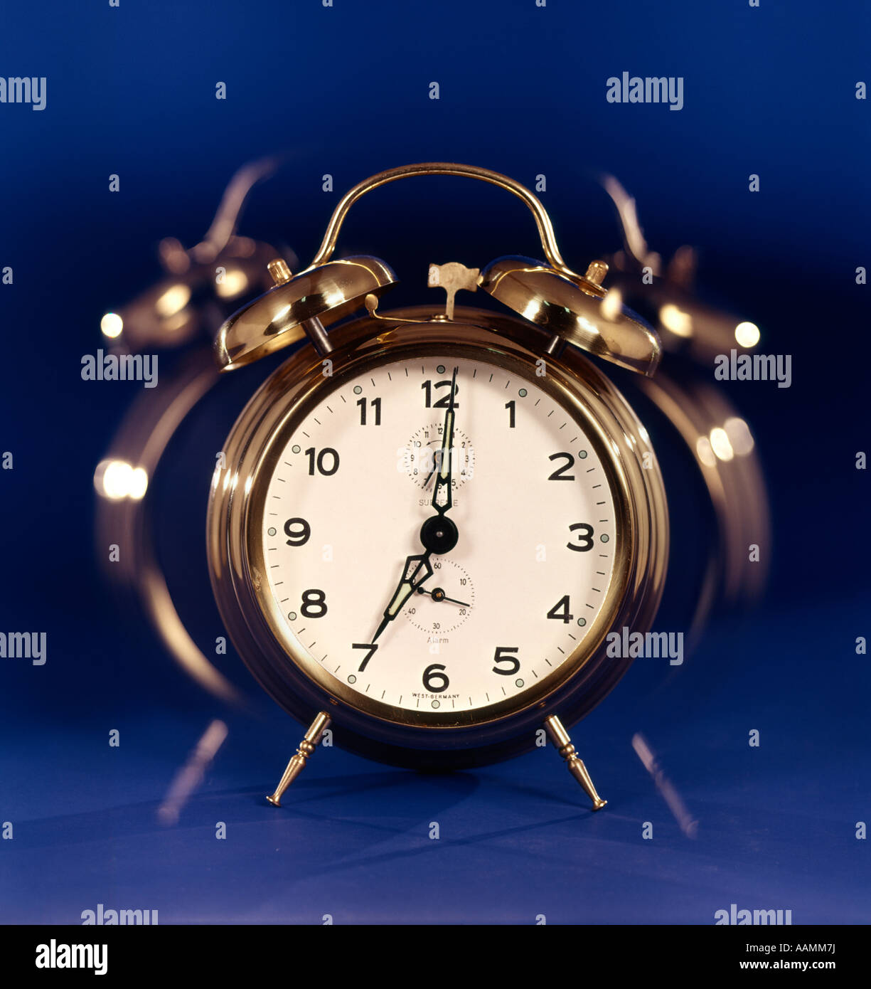 1970s MULTIPLE TIME EXPOSURE OF RINGING CLAPPER BELL ALARM CLOCK ALERT