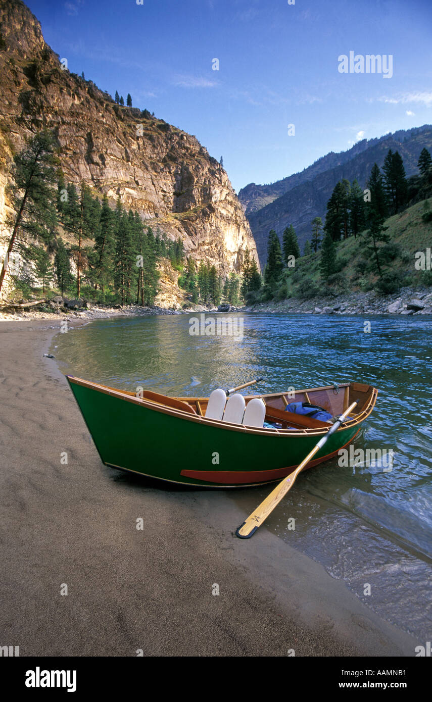 IDAHO, Fishing drift boat parked on sandy beach with canyon back drop