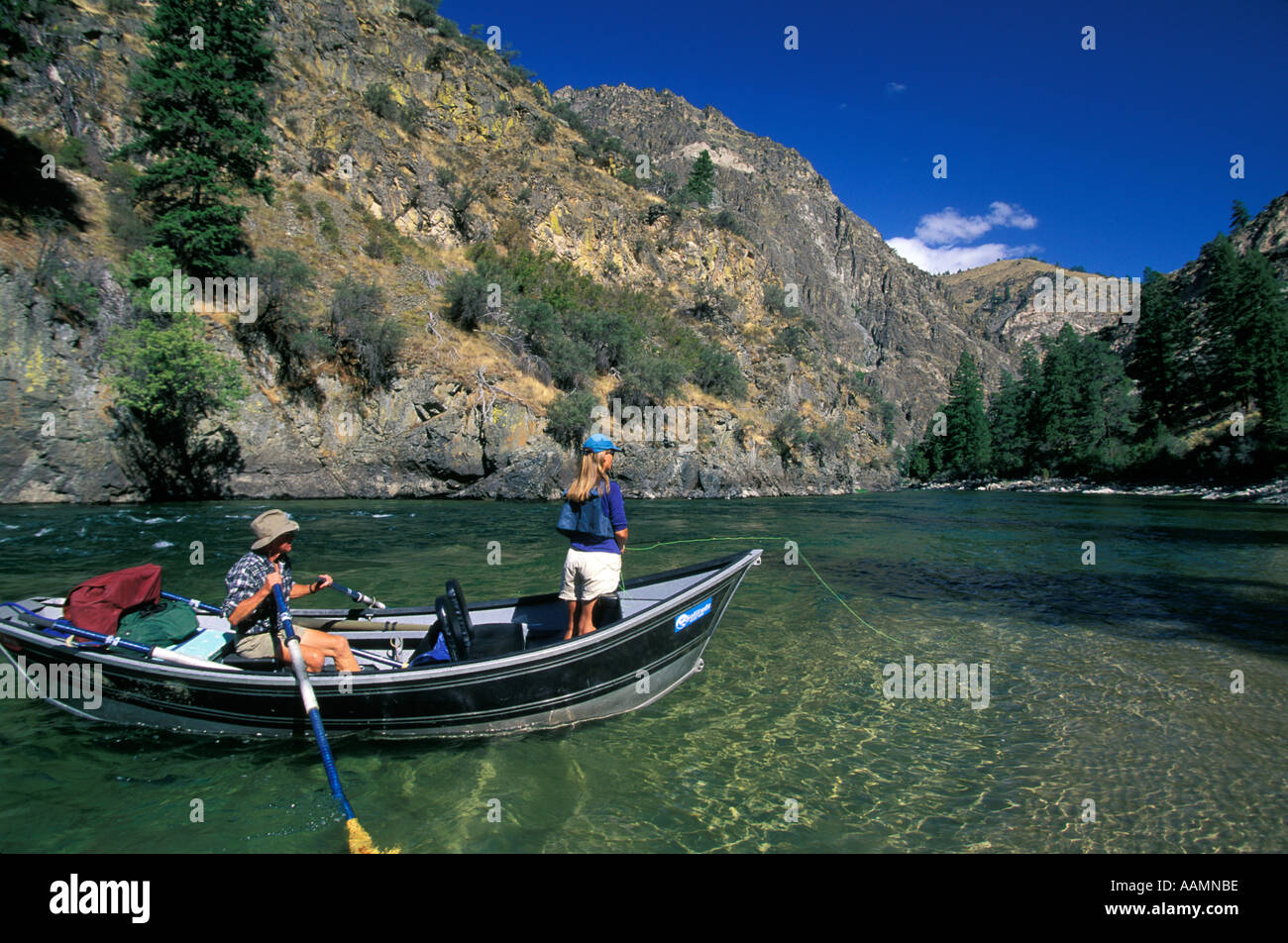 IDAHO Woman Fly Fishing from a drift boat Middle Fork of the Salmon