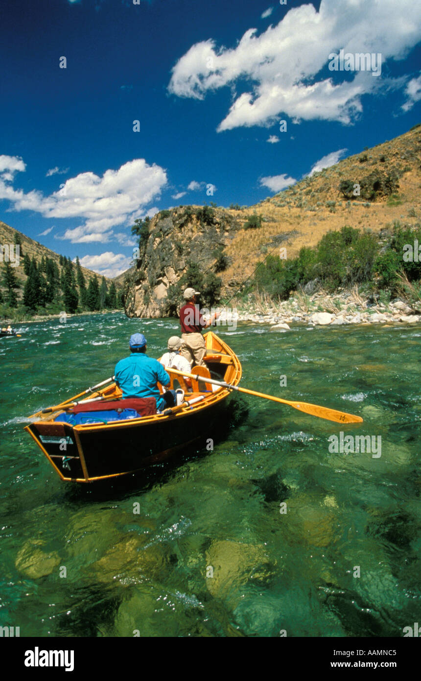IDAHO Man Fly Fishing from drift boat Middle Fork of the Salmon River Frank Church Wilderness Stock Photo