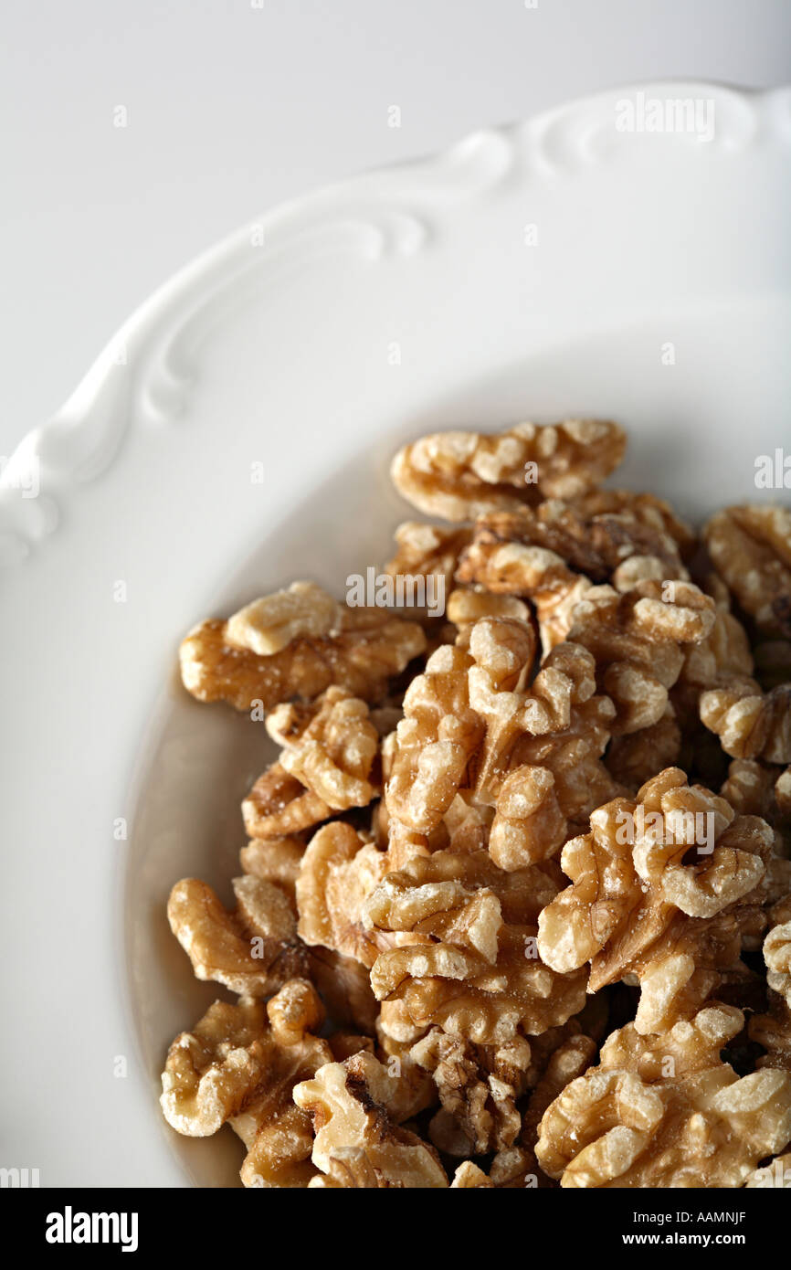Walnuts on white plate Stock Photo