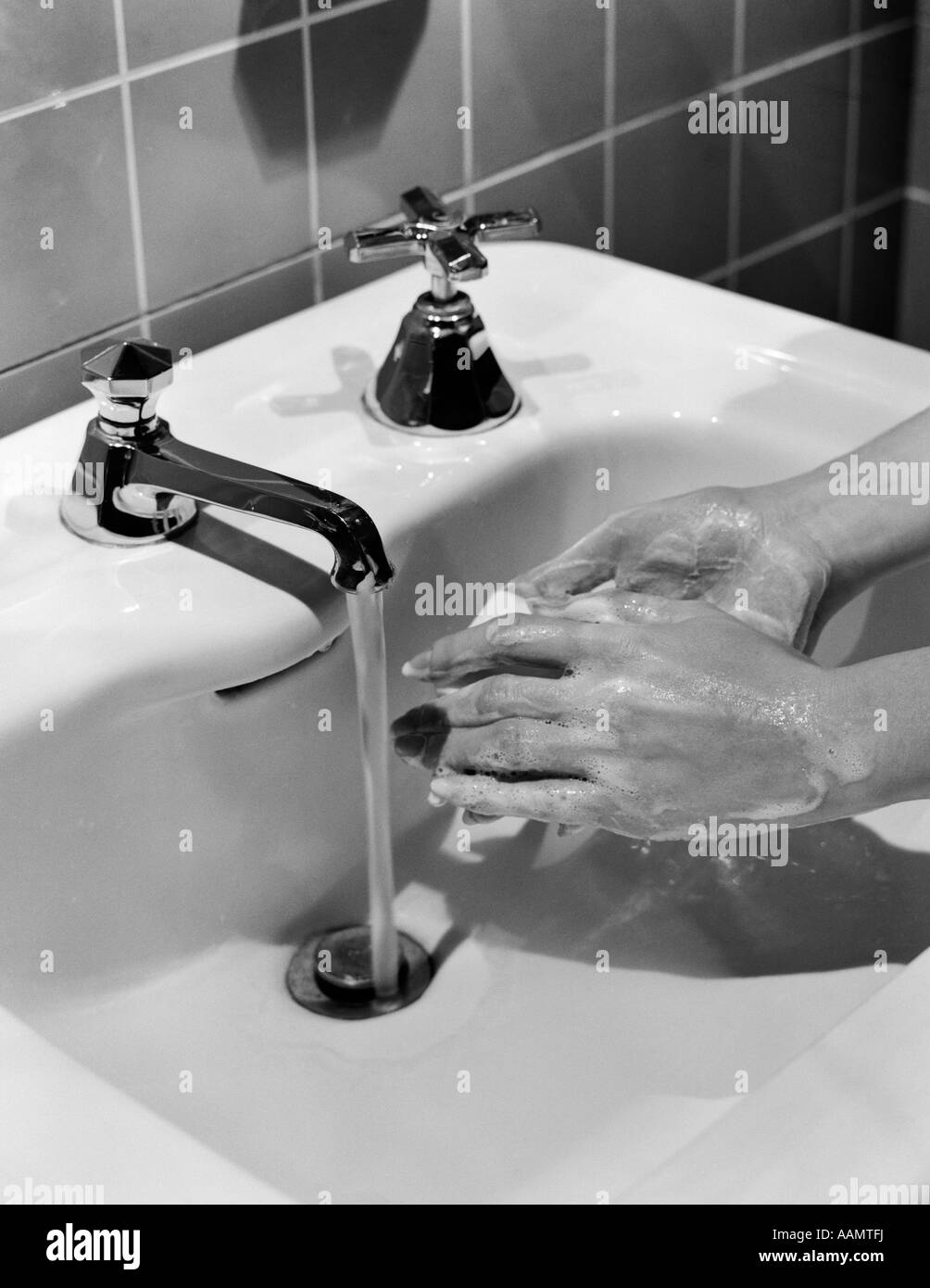 1950s Woman S Hands Lathering Up With Bar Of Soap Under Bathroom Faucet Stock Photo Alamy