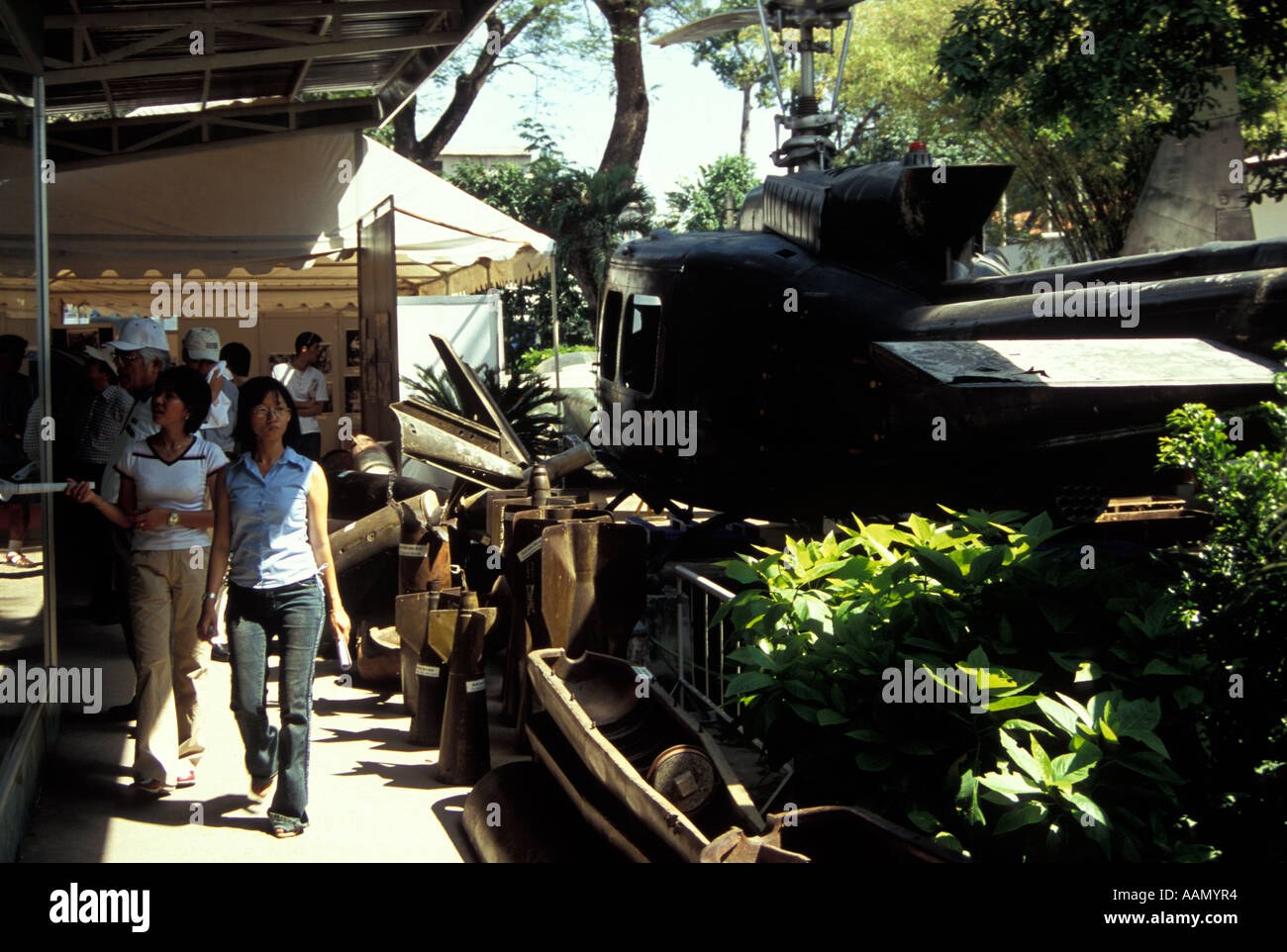 Tourists passing American M41 tank at Revolutionary Museum, Ho Chi Minh City, Vietnam Stock Photo