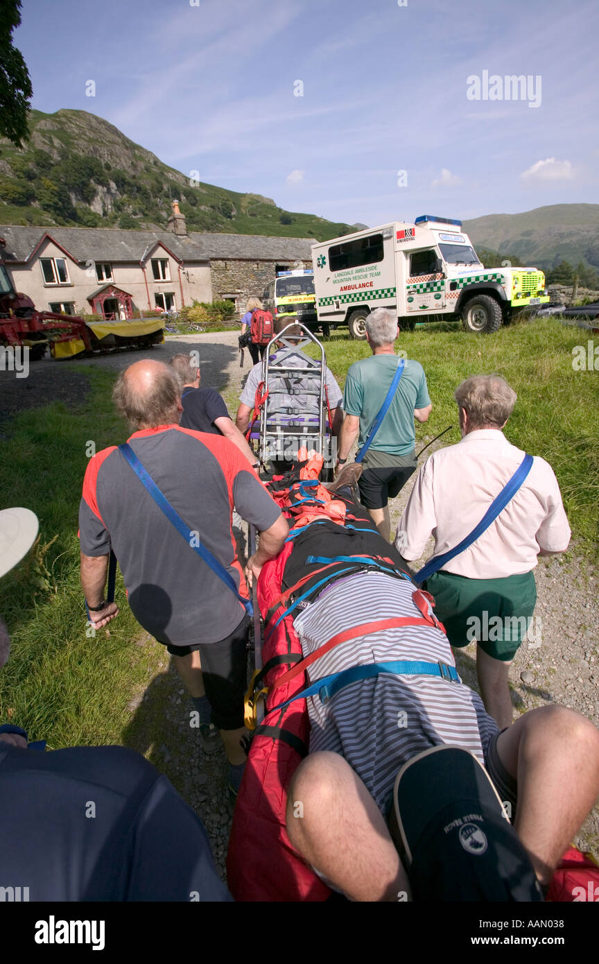 Walking Rescuers Mountain rescue team stretcher an injured walker off the hill Grasmere ...