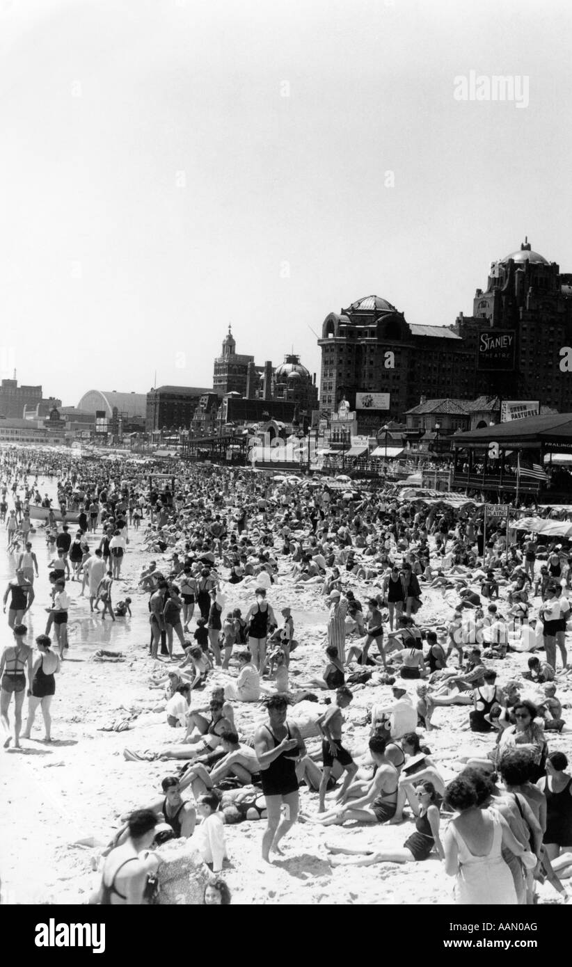 1940s Beach Crowd Of Sunbathers On The Sand In Swimsuits
